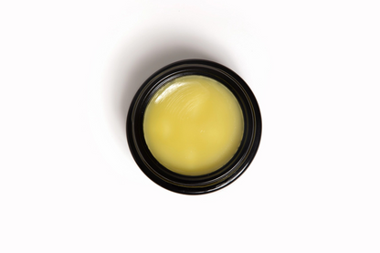 Image of Baubo Le Baume ointment, showcasing its rich yellow texture.