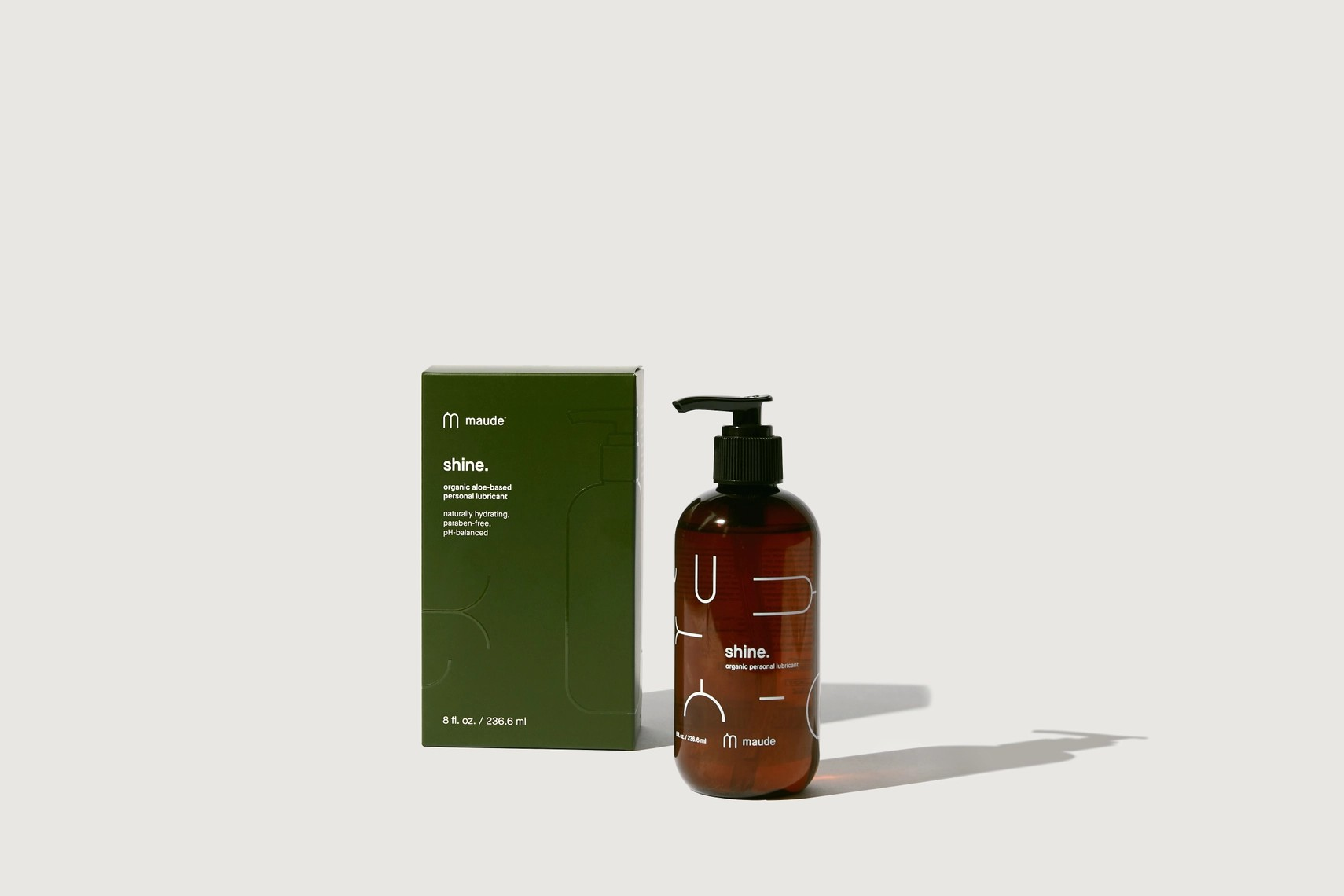 Product shot of Maude Shine, an organic aloe-based lubricant, displayed with its packaging box.