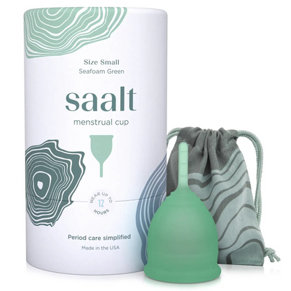 Product shot of the Saalt small size menstrual cup in Desert Blush, displayed alongside its packaging.