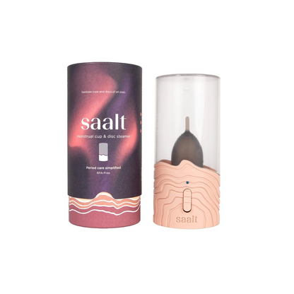 Product shot of the Saalt menstrual cup and disc steamer, displayed along its packaging.